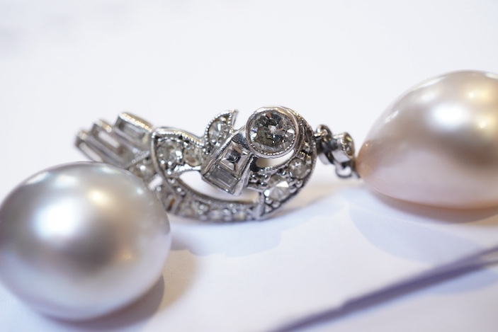 A fine pair of Art Deco natural pearl and diamond earrings, 1930s